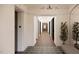 Elegant hallway with detailed tile flooring, overhead lighting, and elevator access at 2201 W Cornwallis Rd # 1B-2, Durham, NC 27705