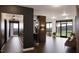 Bright open-concept living area featuring hardwood floors and large windows with scenic views at 2201 W Cornwallis Rd # 2B-21, Durham, NC 27705
