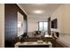 Comfortable living room showcasing textured accent wall, recessed lighting, fireplace, and stylish furniture at 2201 W Cornwallis Rd # 2B-3, Durham, NC 27705