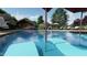 Inviting pool area features a sun-shelf, accessible chair, and lounge chairs at 2201 W Cornwallis Rd # 1B-1, Durham, NC 27705
