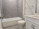 Bathroom featuring hard surface vanity, modern fixtures, and gray tiled shower at 2203 Lambert Rd # 67, Cary, NC 27519