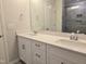 Bathroom featuring double vanity with modern fixtures and tiled shower at 2203 Lambert Rd # 67, Cary, NC 27519