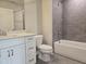 Bathroom featuring a hard surface vanity with modern fixtures and tiled shower at 2203 Lambert Rd # 67, Cary, NC 27519