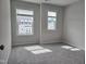 This bedroom offers natural light from the windows and plush carpeting at 2203 Lambert Rd # 67, Cary, NC 27519