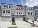 View of new construction townhomes featuring attached garages and neutral toned exteriors at 2203 Lambert Rd # 67, Cary, NC 27519