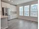 Bright kitchen area with stainless steel appliances, white cabinetry, and ample counter space at 2203 Lambert Rd # 67, Cary, NC 27519
