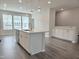 Open concept kitchen area with stainless steel appliances, white cabinetry, and an island at 2203 Lambert Rd # 67, Cary, NC 27519
