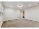 Spacious bedroom with carpet floors, neutral paint, one window, and an access door to the attic at 226 Begen St, Morrisville, NC 27560