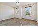 This bedroom offers two windows, neutral walls, and carpeted floors at 226 Begen St, Morrisville, NC 27560