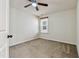 Cozy bedroom with carpet, a ceiling fan, neutral paint, and a window at 226 Begen St, Morrisville, NC 27560
