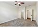Bedroom with closet and ensuite access, with neutral carpet and ceiling fan at 226 Begen St, Morrisville, NC 27560