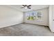 Bedroom with carpet, tray ceiling, and ample natural light streaming through the windows at 226 Begen St, Morrisville, NC 27560
