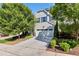 Charming two-story home with a two-car garage, complemented by lush landscaping and a concrete driveway at 226 Begen St, Morrisville, NC 27560