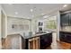 Modern kitchen featuring a granite island and views of living spaces at 226 Begen St, Morrisville, NC 27560