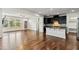 Open-concept living space with wood floors connecting kitchen and living room with natural light at 226 Begen St, Morrisville, NC 27560