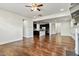 Spacious living room with hardwood floors, open to kitchen and fireplace at 226 Begen St, Morrisville, NC 27560