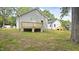 View of the home's backyard and the deck and stairs from the back of the home at 2305 Pinecroft Dv, Burlington, NC 27217