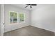 Bright bedroom with natural light from two windows and a ceiling fan at 2305 Pinecroft Dv, Burlington, NC 27217
