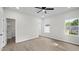 Spacious bedroom featuring neutral walls and floor, ceiling fan, and natural light at 2305 Pinecroft Dv, Burlington, NC 27217