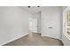 Neutral-toned bedroom with a closet, a window, and wood-look flooring at 2305 Pinecroft Dv, Burlington, NC 27217