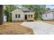 Newly constructed home with a front porch and a well-maintained yard at 2305 Pinecroft Dv, Burlington, NC 27217