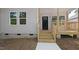 Gray home with light stained porch and steps at 2305 Pinecroft Dv, Burlington, NC 27217