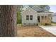 Charming home with a front porch, steps, and a welcoming entrance at 2305 Pinecroft Dv, Burlington, NC 27217