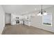 Bright kitchen featuring modern appliances, white cabinets, and granite countertops at 2305 Pinecroft Dv, Burlington, NC 27217