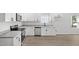 Modern kitchen with stainless steel appliances, white cabinets, and granite countertops at 2305 Pinecroft Dv, Burlington, NC 27217
