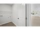 White laundry room with shelving for storage and modern fixtures at 2305 Pinecroft Dv, Burlington, NC 27217