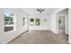 A bright living room with large windows and new flooring at 2305 Pinecroft Dv, Burlington, NC 27217