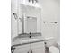Well-lit bathroom featuring granite countertops and modern fixtures at 2309 Pinecroft Dr, Burlington, NC 27217