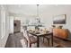 Modern dining room with stainless steel appliances and an adjacent dining area at 2309 Pinecroft Dr, Burlington, NC 27217