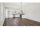 Bright kitchen featuring stainless appliances, granite counters, white cabinets and hardwood flooring at 2309 Pinecroft Dr, Burlington, NC 27217