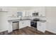 Modern kitchen features stainless steel appliances, granite countertops, and white cabinetry at 2309 Pinecroft Dr, Burlington, NC 27217