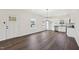 Bright living room showcasing wood floors, white walls, lots of windows, and an open layout at 2309 Pinecroft Dr, Burlington, NC 27217