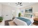 Cozy main bedroom with an ensuite bathroom, neutral decor, and a ceiling fan at 2309 Pinecroft Dr, Burlington, NC 27217