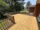 Spacious back deck featuring wood construction, backyard access, and privacy at 2433 Zacks Mill Rd, Angier, NC 27501