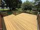 Spacious back deck featuring wood construction and a natural, backyard view at 2433 Zacks Mill Rd, Angier, NC 27501