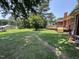 Large backyard with a spacious deck and a mix of sun and shade for outdoor enjoyment at 2433 Zacks Mill Rd, Angier, NC 27501