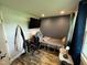 Functional bedroom includes a large television and ample natural light at 2433 Zacks Mill Rd, Angier, NC 27501