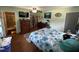 Cozy bedroom featuring hardwood floors and a view of the bathroom at 2433 Zacks Mill Rd, Angier, NC 27501