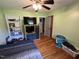 Bedroom featuring hardwood floors and storage space at 2433 Zacks Mill Rd, Angier, NC 27501
