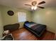 Bedroom featuring hardwood floors, a ceiling fan and a closet at 2433 Zacks Mill Rd, Angier, NC 27501