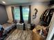 Bedroom featuring hardwood floors, natural light, closet, and storage at 2433 Zacks Mill Rd, Angier, NC 27501