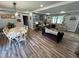 Charming dining room area that flows into the living room and features custom hardwood floors at 2433 Zacks Mill Rd, Angier, NC 27501