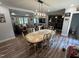 Bright dining area with wood floors, connected to the living room, perfect for Gathering gatherings at 2433 Zacks Mill Rd, Angier, NC 27501