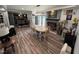 Spacious dining area with fireplace that flows into the kitchen with granite counters at 2433 Zacks Mill Rd, Angier, NC 27501
