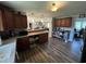 Open kitchen design featuring hardwood floors and seamless connection to the living space at 2433 Zacks Mill Rd, Angier, NC 27501