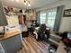 Functional laundry room with cabinets, large window, washer, dryer, and work space at 2433 Zacks Mill Rd, Angier, NC 27501